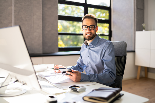 Business Accountant Accountant And Bookkeeper. Invoice And Calculator A Focus on Acquisitions