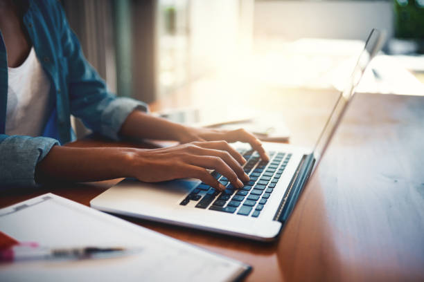 Closeup shot of an unrecognizable woman using a laptop while working from home Compare Other HSBC Products