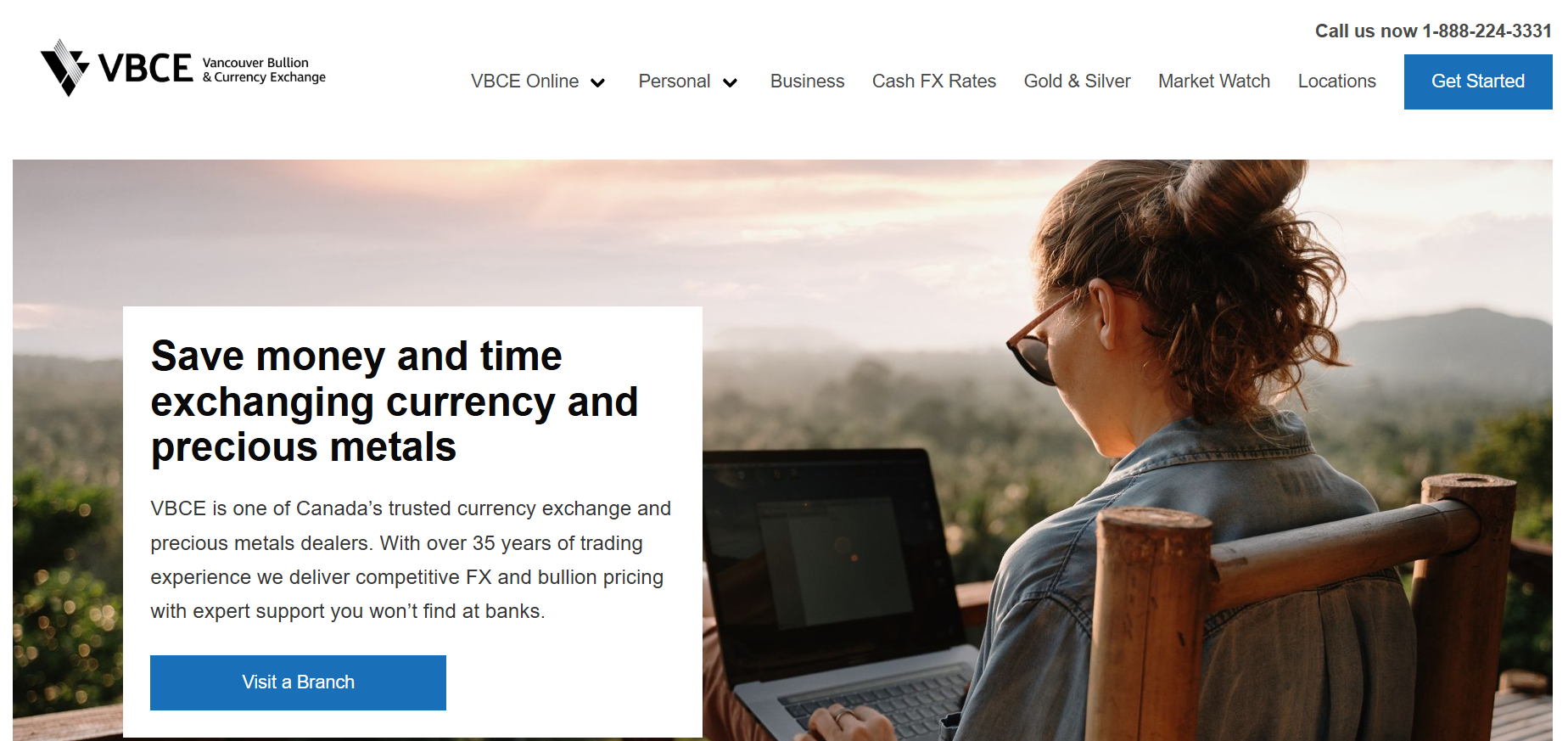 VBCE homepage promoting currency exchange and precious metals services beside a traveler using a laptop outdoors